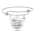 Scripture bangle bracelet featuring cross heart and round designs