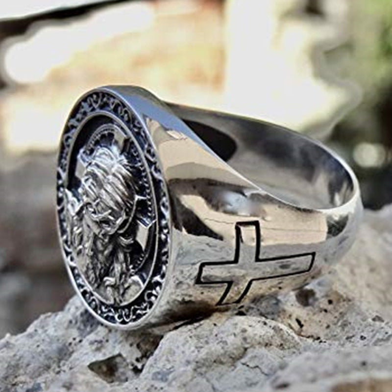 Close-up of men's punk ring featuring a Jesus cross design in silver-tone finish