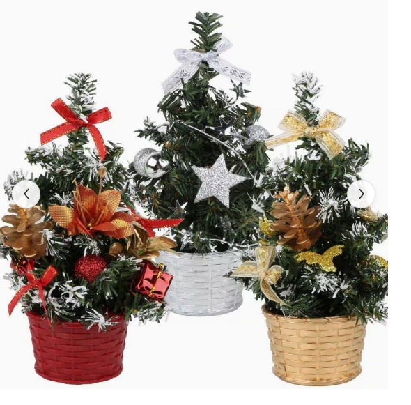 Three miniature decorated Christmas trees arranged together for tabletop display