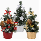 Three miniature decorated Christmas trees arranged together for tabletop display
