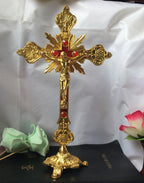 Ornate crucifixion wall piece in red copper finish