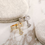 Men's cross ring styled on hand showing fit and silhouette
