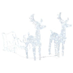 Lighted reindeer sleigh decoration set against winter evening scene