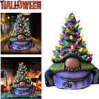 Lighted resin Christmas tree sculpture showing holiday decoration detail