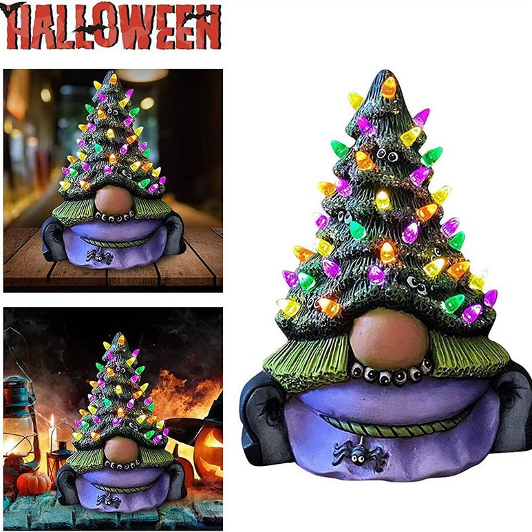 Lighted resin Christmas tree sculpture showing holiday decoration detail