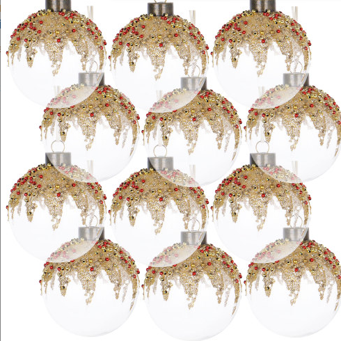 Festive Christmas ornaments displayed on a tree with warm lighting