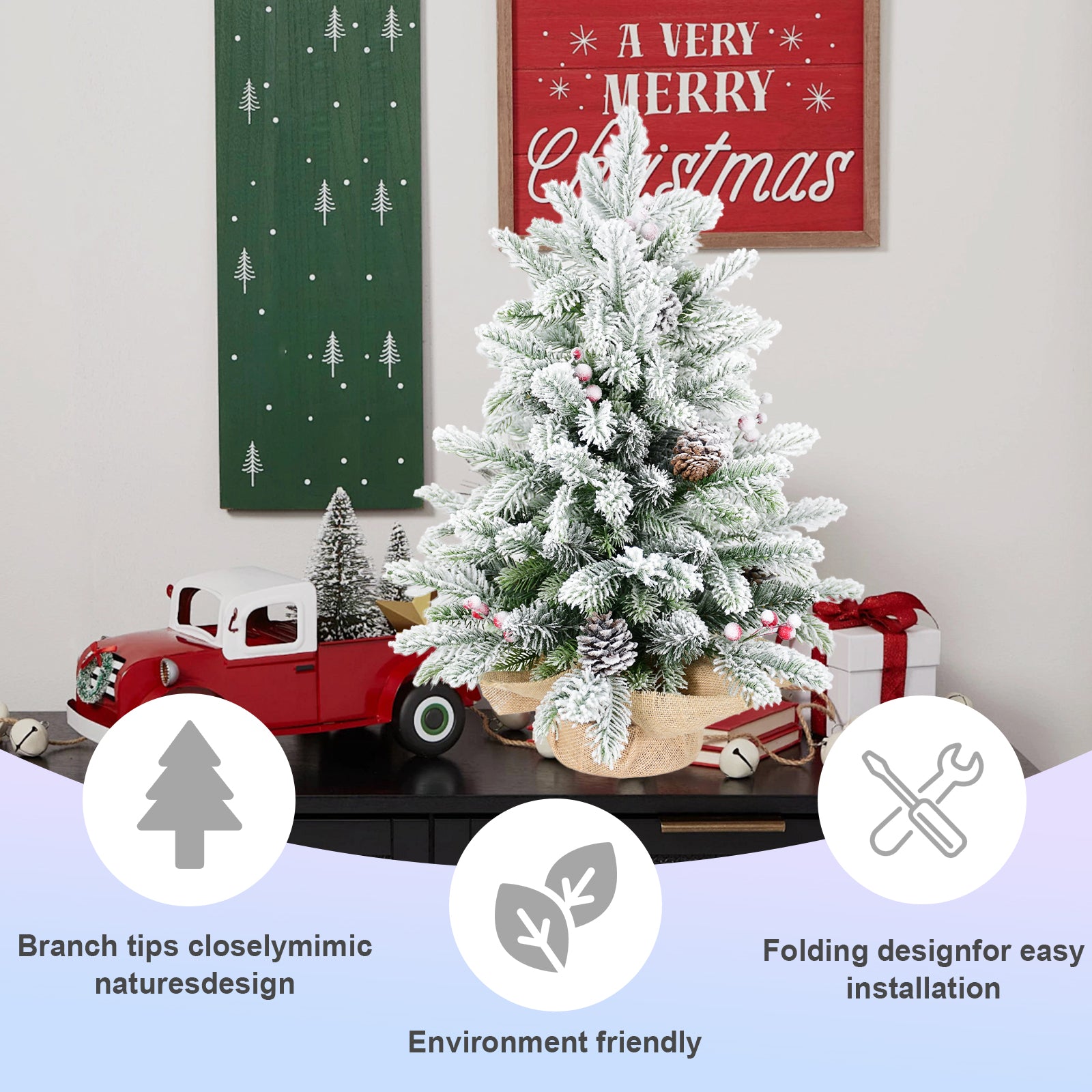 Snow flocking detail on green artificial Christmas tree branches