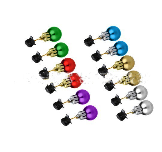 Holiday hair clips with ornament balls and bells styled in a Christmas arrangement