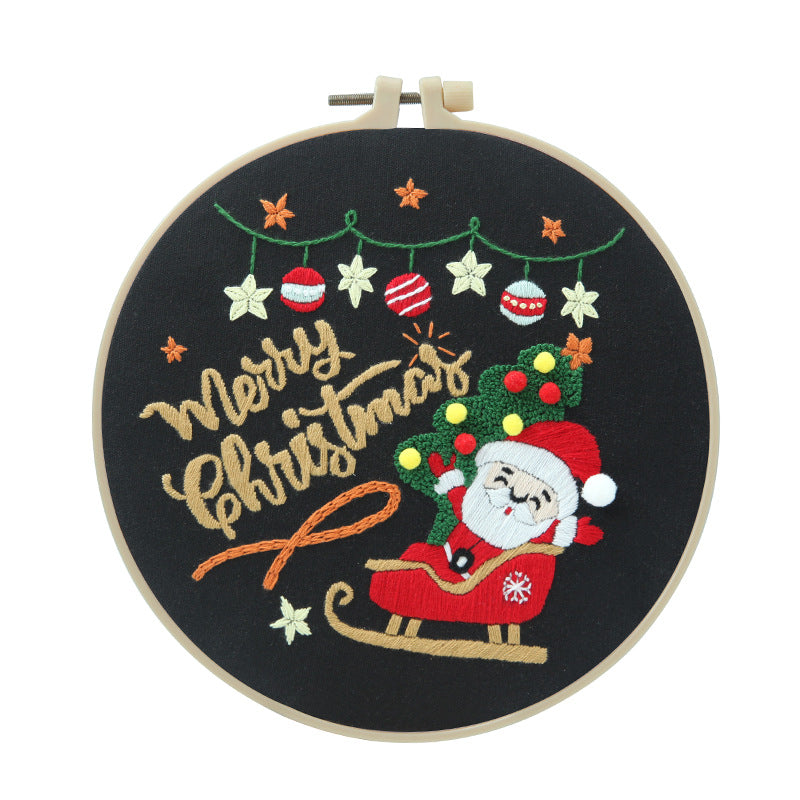 Round Christmas embroidery design showing friendly snowman character in white frame