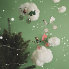 Holiday ornament detail showing iron and resin craftsmanship