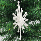 Elegant white snowflake Christmas pendant catching light