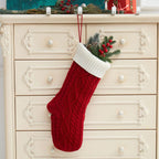 Festive knitted Christmas gift bag in warm neutral tones for holiday giving