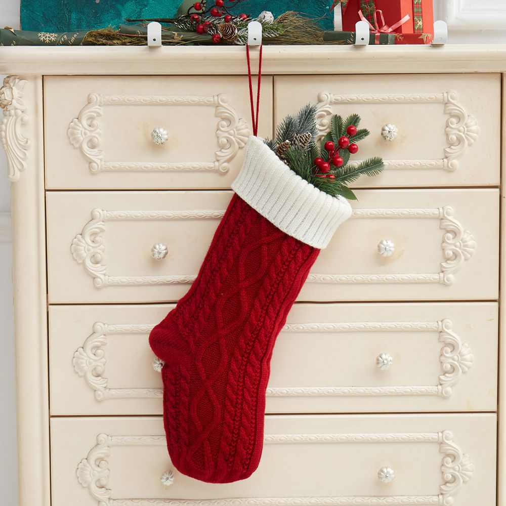 Festive knitted Christmas gift bag in warm neutral tones for holiday giving