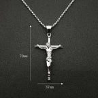 Stack of individually packaged titanium steel cross necklaces