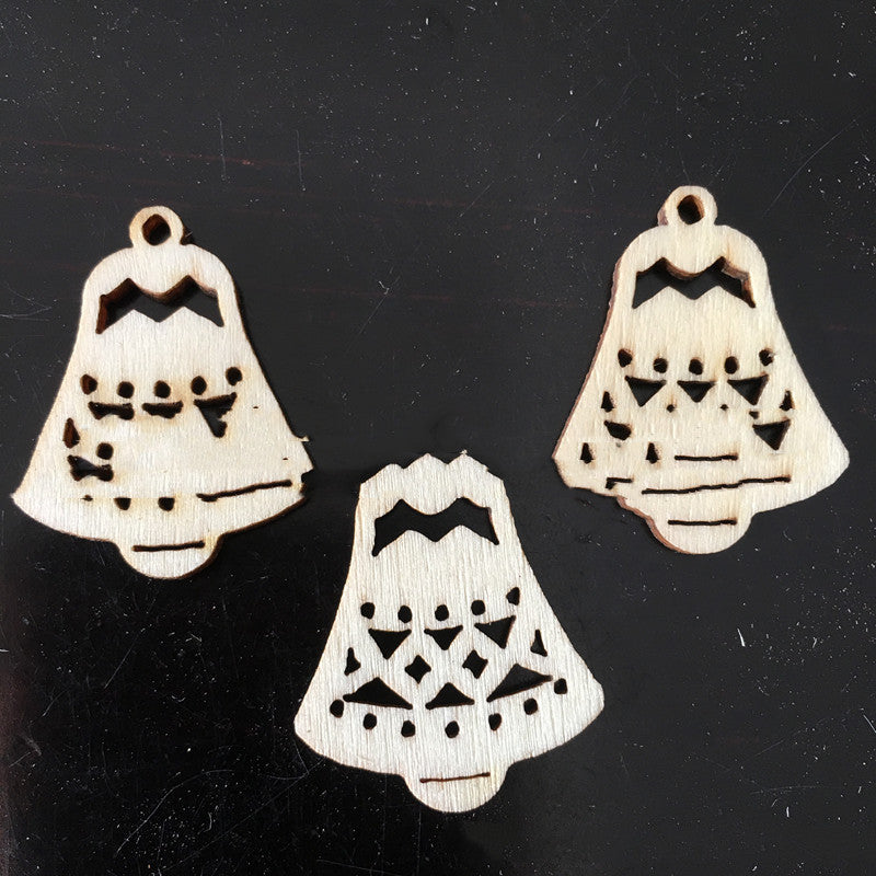 Small wooden Christmas pendant detail showing cartoon design