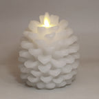 Brown frost pinecone candle in cozy winter living room setting, Pinecone Christmas Candle, home decor