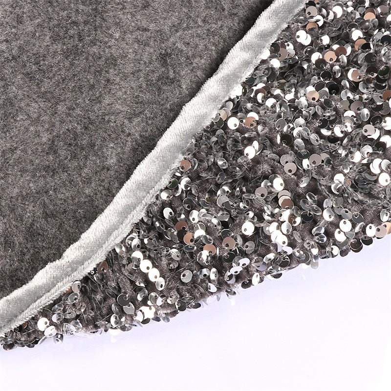 Silver gray sequin Christmas tree skirt displayed flat with shimmering surface detail