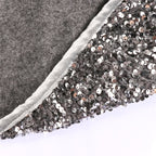 Silver gray sequin Christmas tree skirt displayed flat with shimmering surface detail