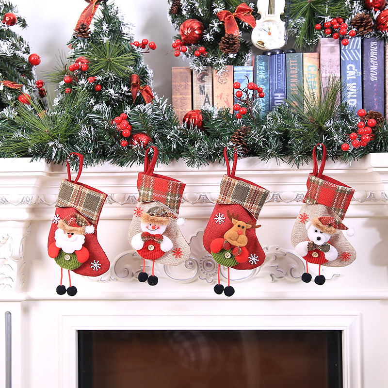 Holiday stocking ornament with snowflake and woodland creature motifs