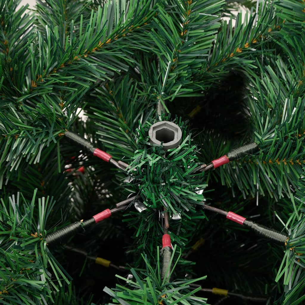 Artificial evergreen tree with folding branches and decorative cones displayed in a home setting