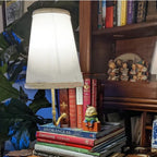 Christmas classic literary lamp displayed on wooden shelf