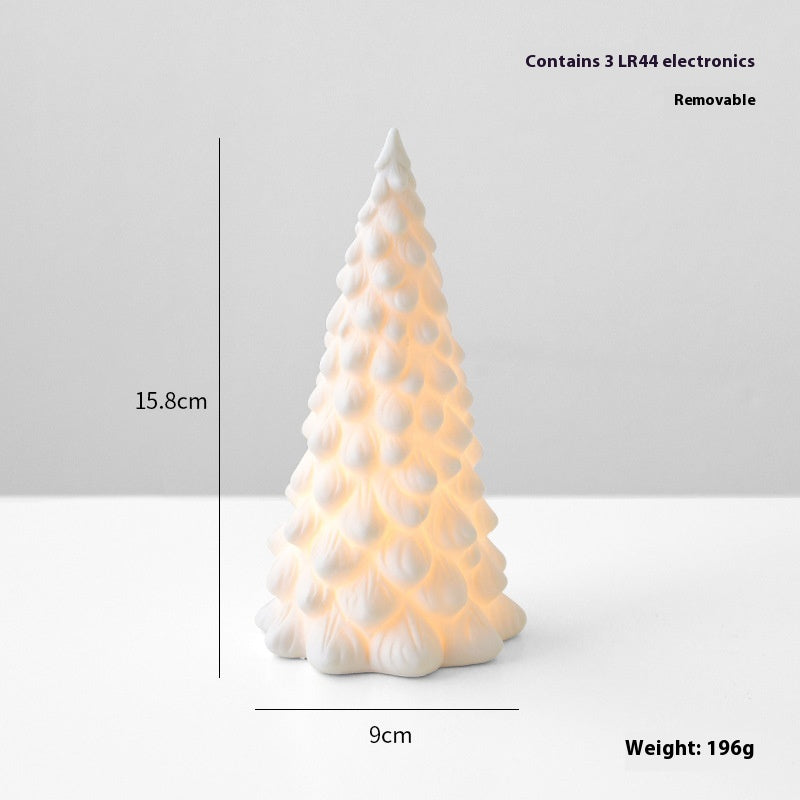 Luminous ceramic Christmas tree desktop decoration glowing softly for holiday ambiance