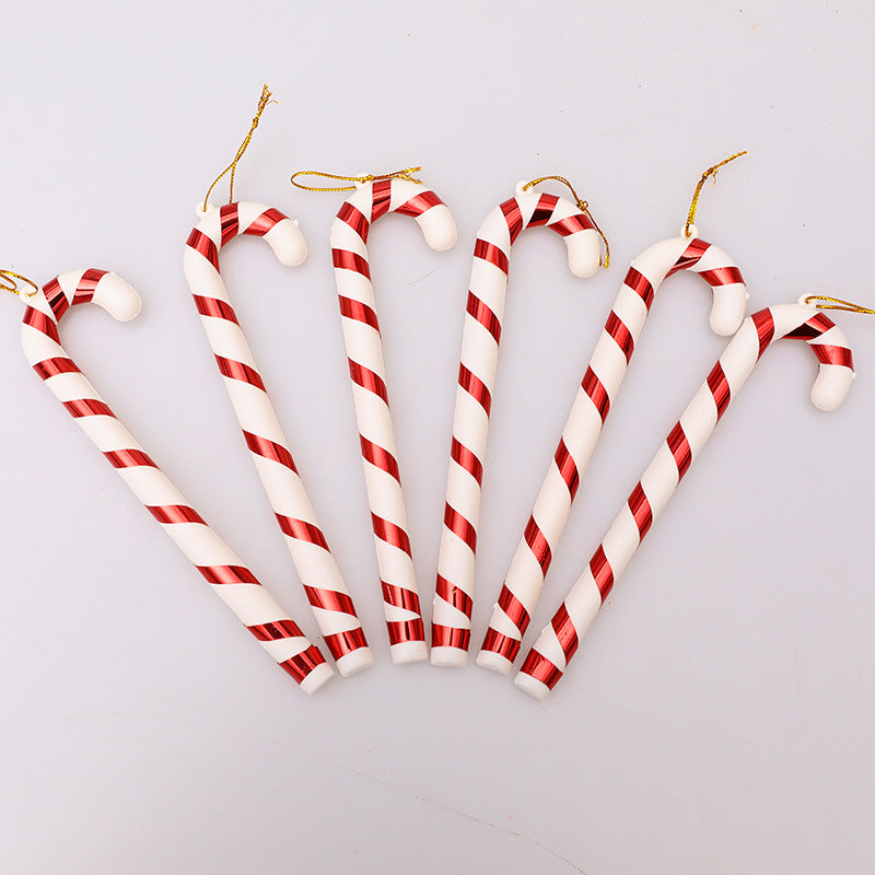 Colorful red and white Christmas tree crutches in holiday setting