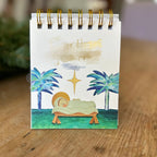 Close-up of paper Christmas ornament featuring Finding God countdown design, Advent theme