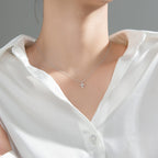 Cross pendant on adjustable silver chain