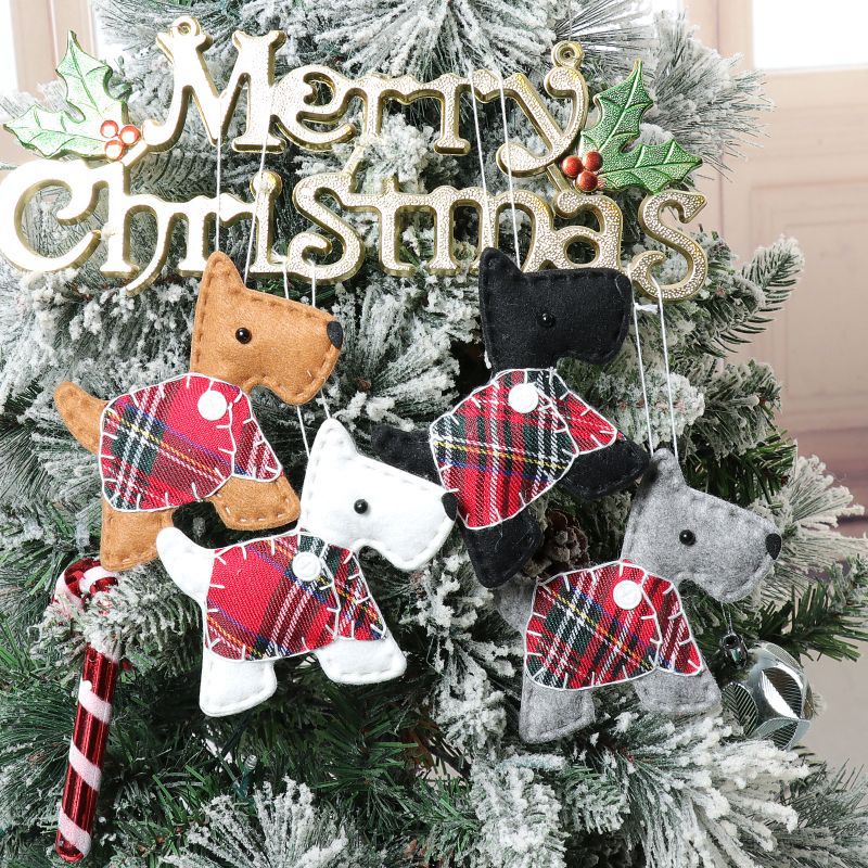 Black dressed dog ornament with Christmas tree pendant for holidays