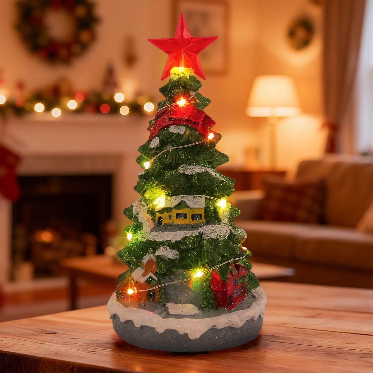 Glowing Christmas tree music box set on a wooden surface
