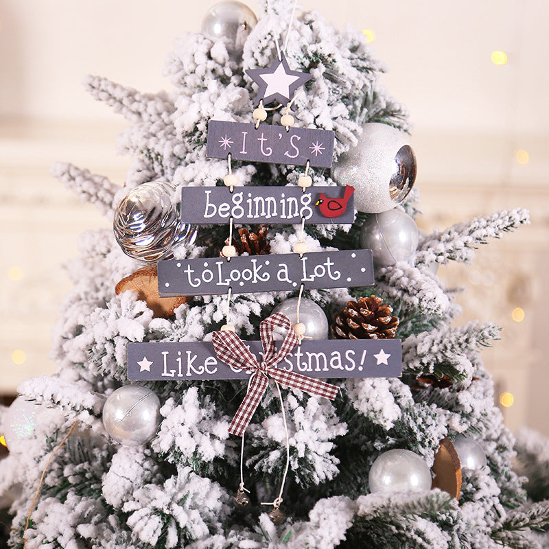 Five-pointed wooden star Christmas ornament with alphabet letters hanging on tree - faith Christmas decor