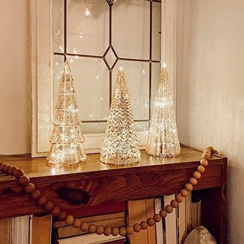 Glass LED Christmas tree topper light ornament with festive glow for holiday decor Main image