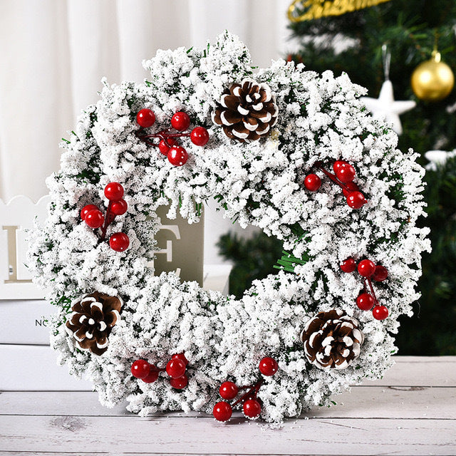 Handmade Christmas garland with flowers and knots on white background Main image