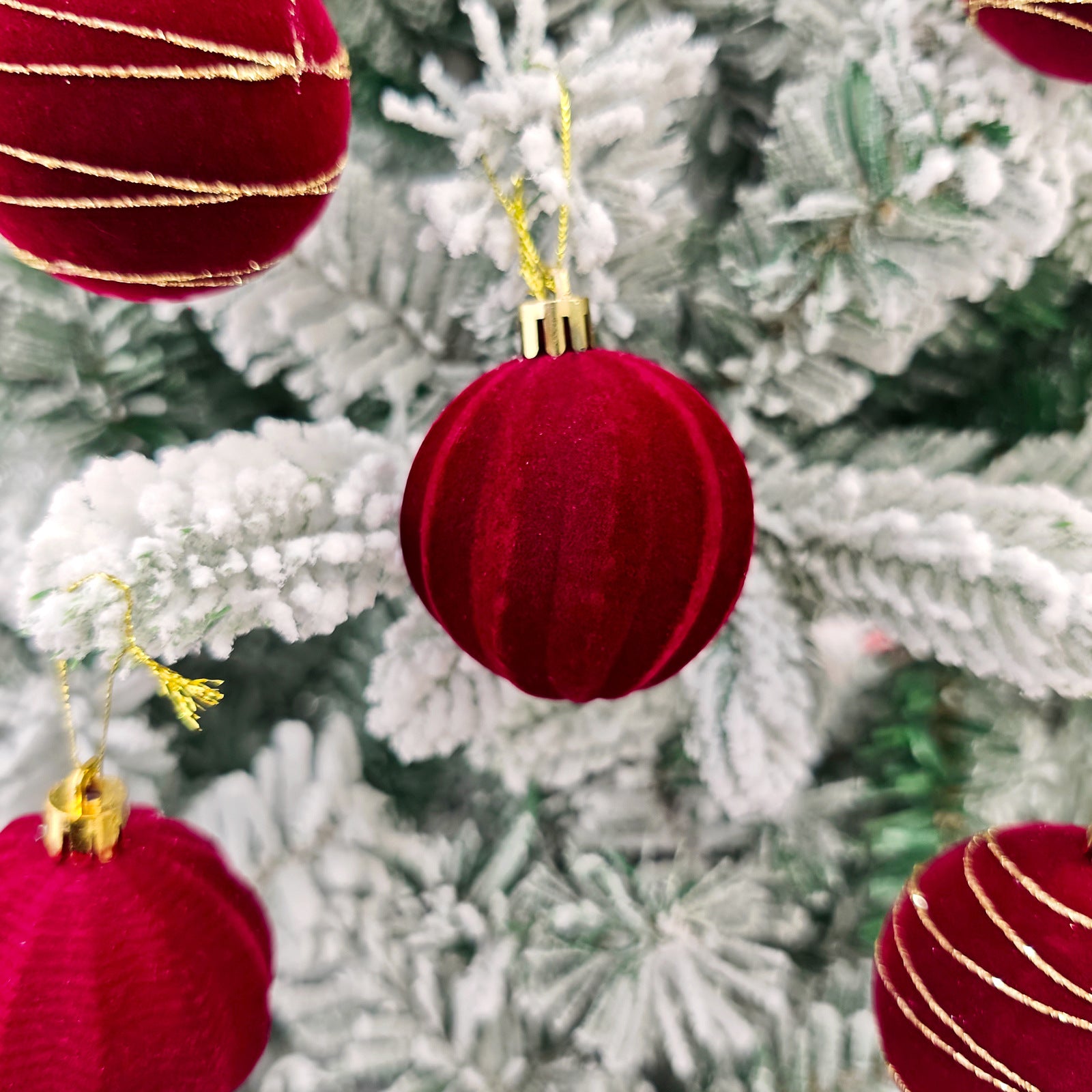 Holiday ornament arrangement featuring gold and white decorative balls