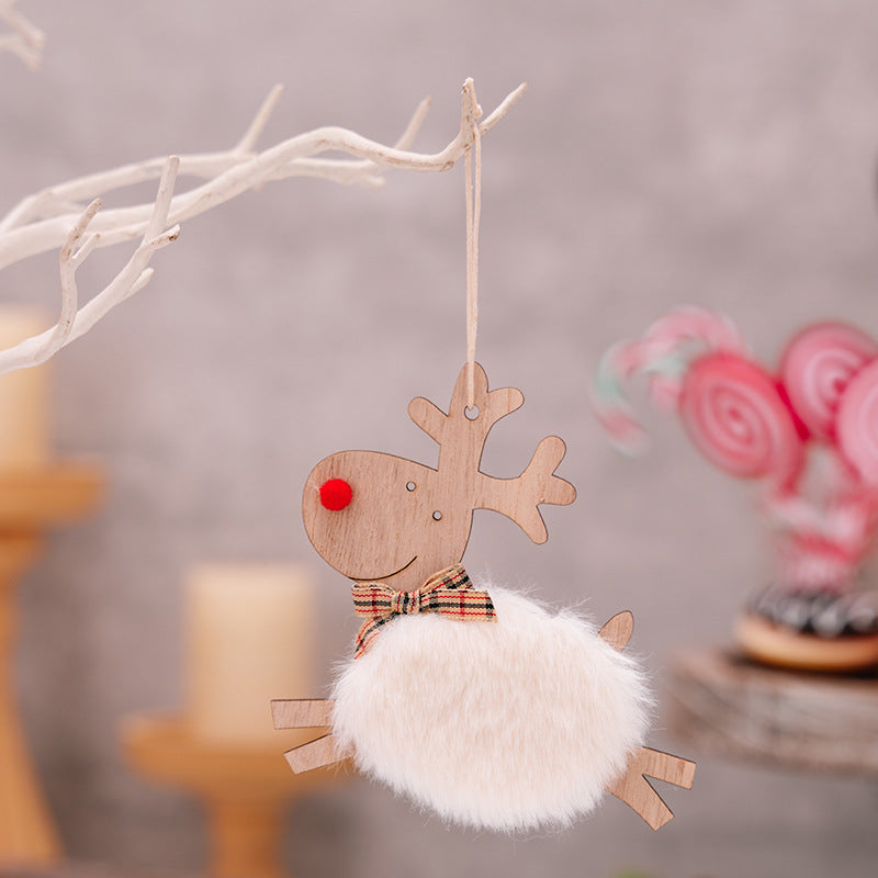 Wooden elk ornament styled on rustic Christmas wreath