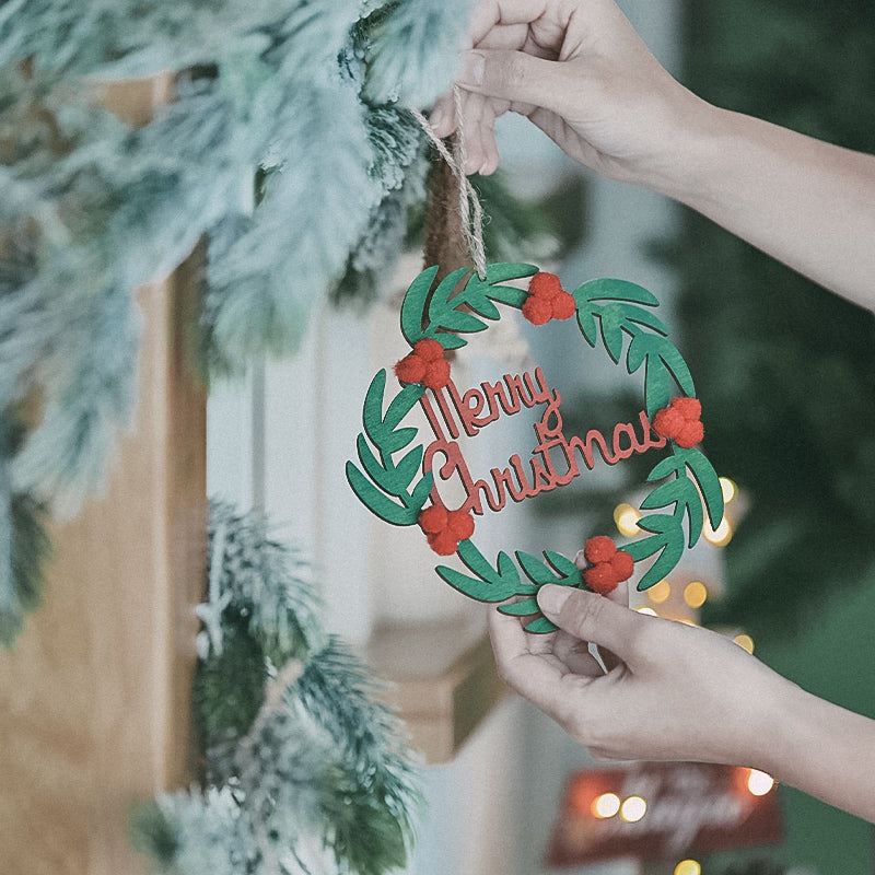 Small dark green wooden pendant ornament for holiday display