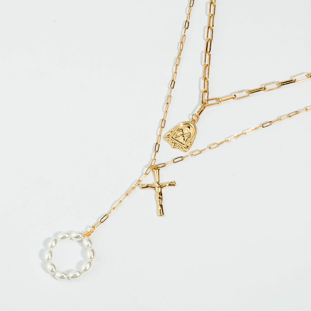 Elegant golden cross necklace with intricate chain design for women