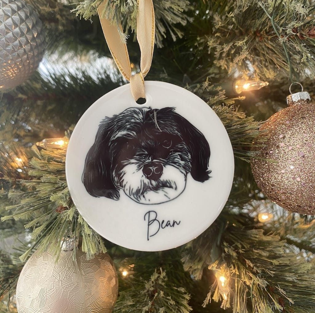 Close-up view of personalized pet portrait on porcelain ornament