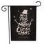 Santa Claus garden flag with cheerful holiday design displayed outdoors in snowy setting
