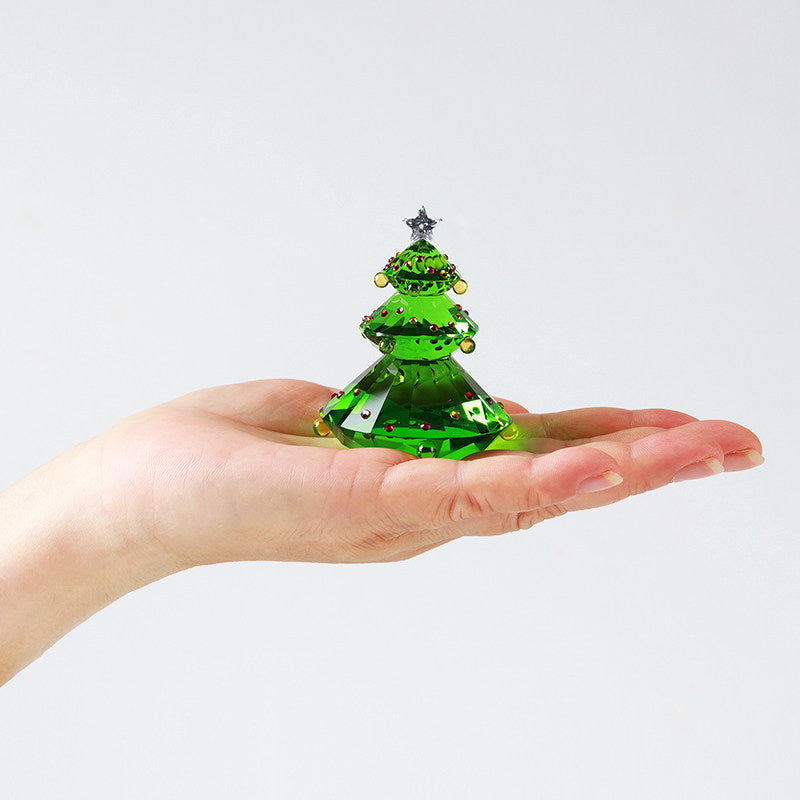Christmas tree ornament with warm lighting in festive setting
