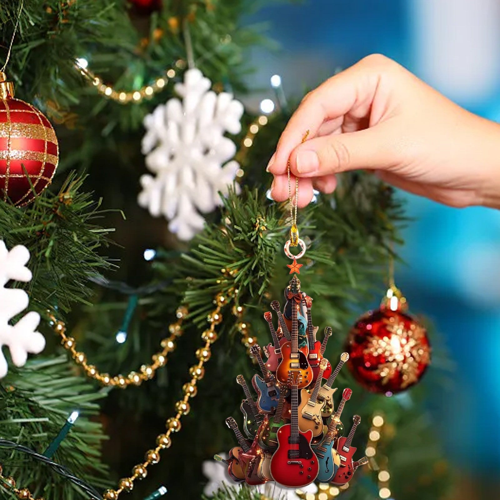 Guitar pendant ornament in cozy Christmas setting