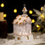 Crystal church music box ornament with intricate details glowing warmly for Christmas