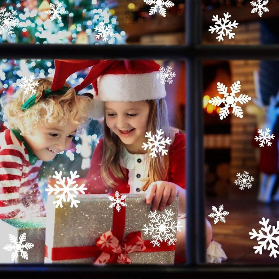 Christmas window decor with elegant white snowflake stickers creating a winter scene