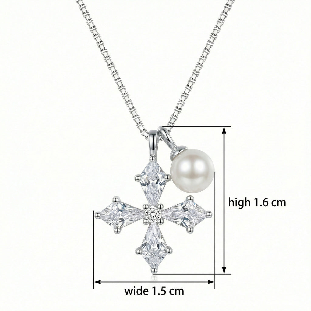 Close-up of sparkling kite-shaped cubic zirconia stones on a silver cross pendant
