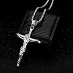 Close-up of gilded cross pendant with Jesus detail