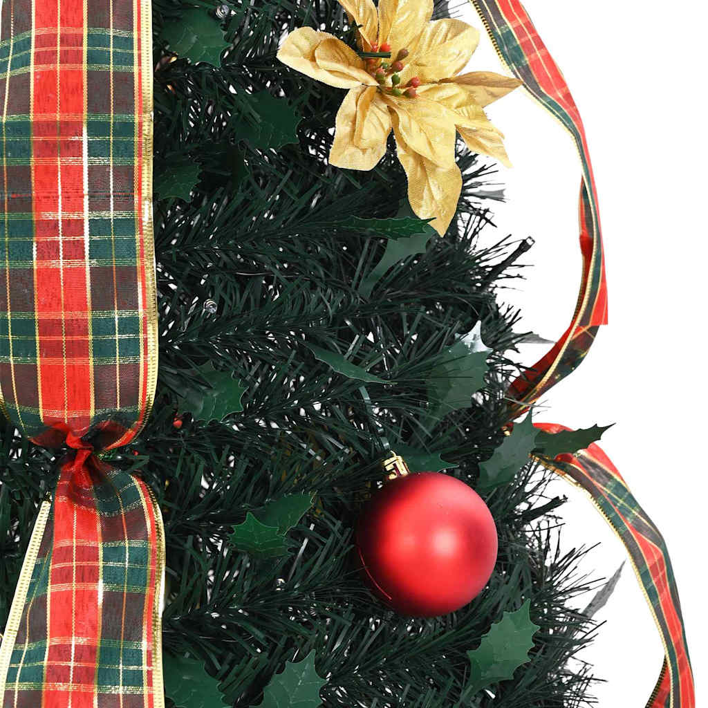 Festive green Christmas tree with warm white LED lights in cozy indoor setting