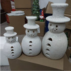 Medium-sized retro snowman ornament in warm holiday setting with ribbon detail